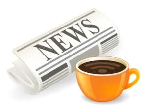 Newspaper and coffee cup on white background