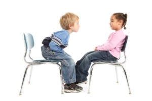 Little boy and little girl having a staring contest